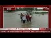 कुरवाई में कमर तक पानी में चलकर फहराया झंडा